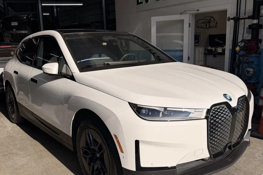 White BMW iX electric SUV at EV Central Service EV body shop near Mission District San Francisco