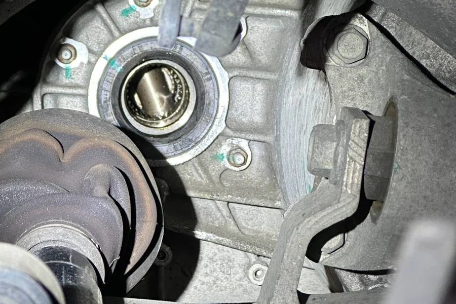 Tesla drive unit output shaft bearing exposed during noise diagnosis at EV Central SF
