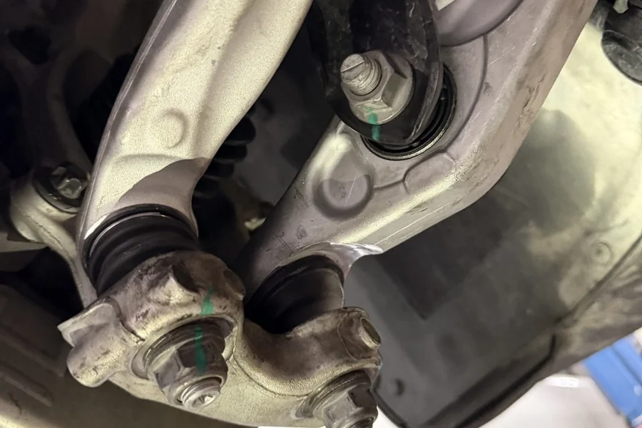 Tesla suspension control arm hardware with torque marker at EV Central Service mechanical service Oakland Bay Area