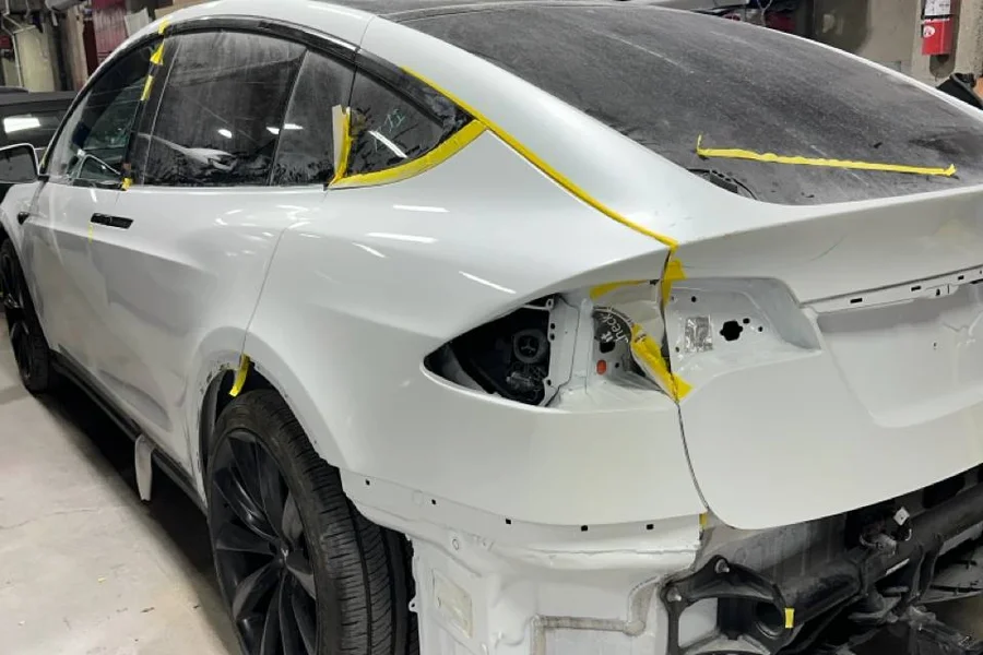 Tesla Model X with rear collision damage and masking prep at EV Central Service San Francisco