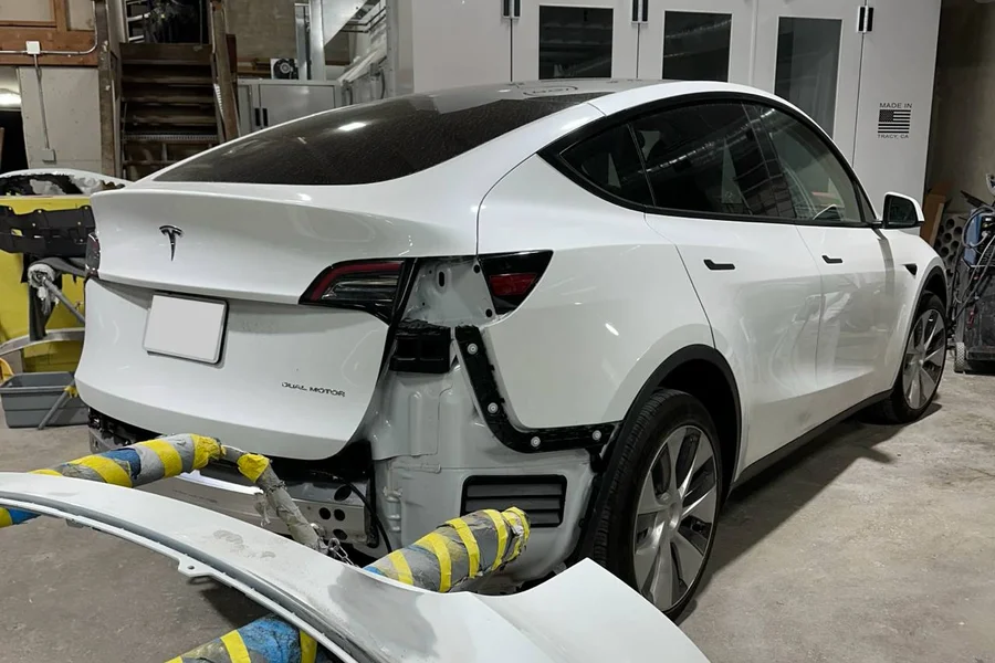Tesla Model Y rear bumper removed for collision repair at EV Central Service San Francisco shop