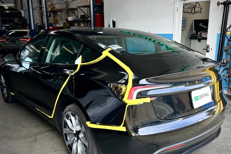 Tesla Model 3 collision repair with masking tape at EV Central Service San Francisco shop