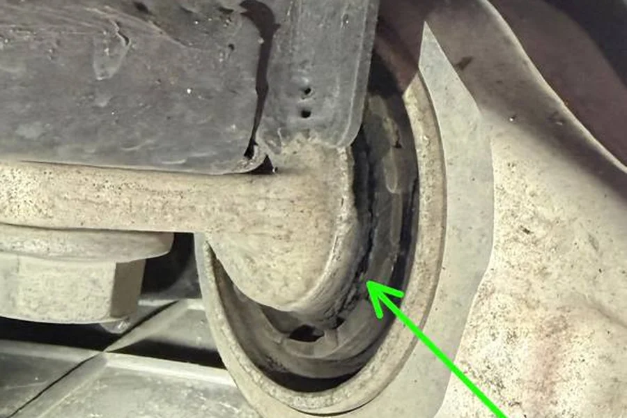 Worn Tesla suspension bushing causing clunking noise over bumps, diagnosed at EV Central Service San Francisco